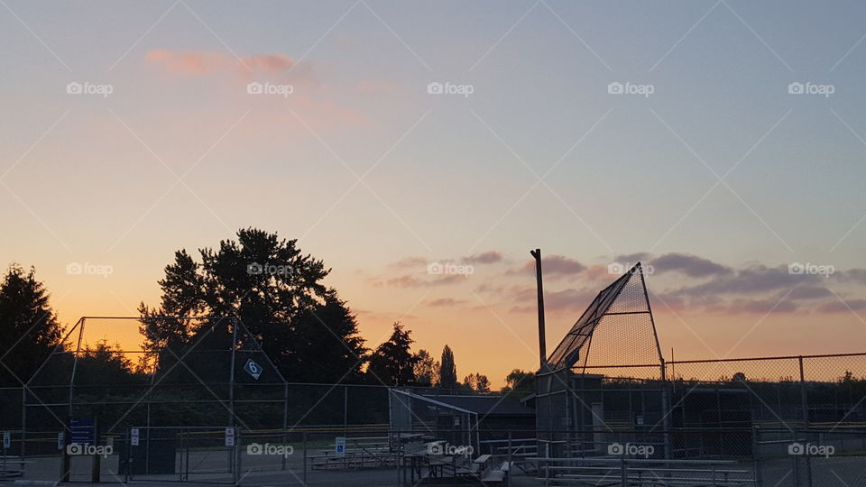 sunset over backstop