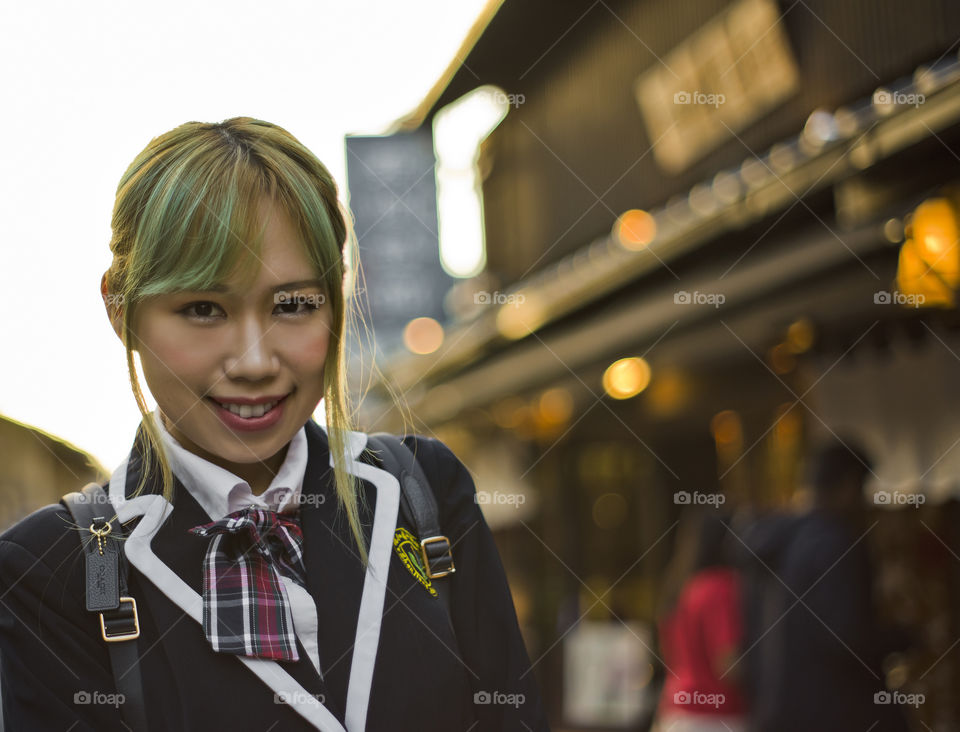 Portrait of Japanese school girl cosplay in the street of Kyoto