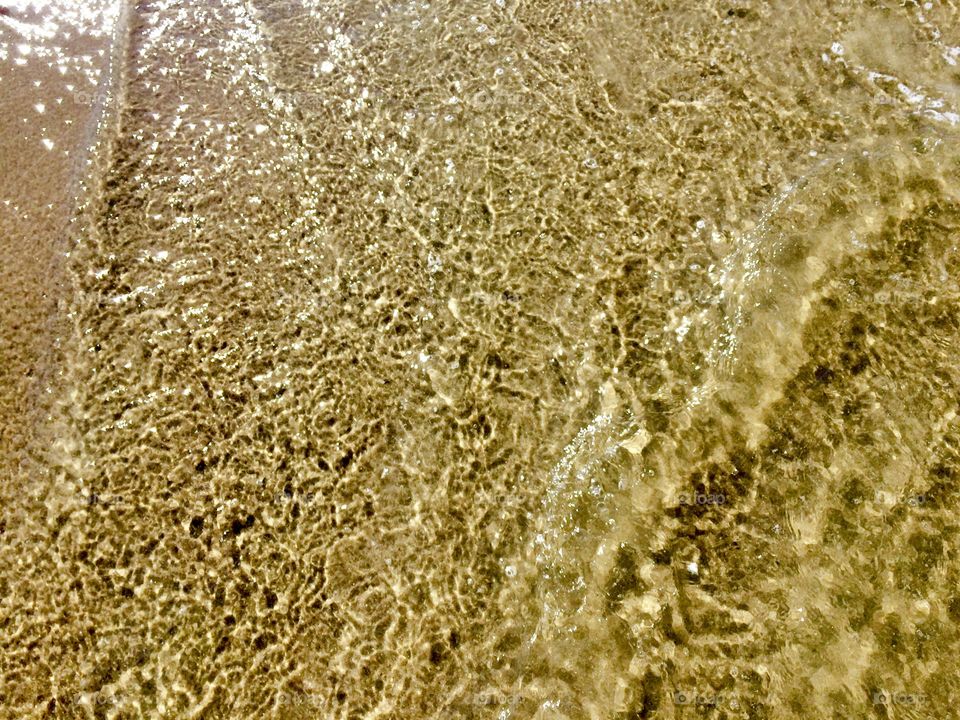 Sand under water lay