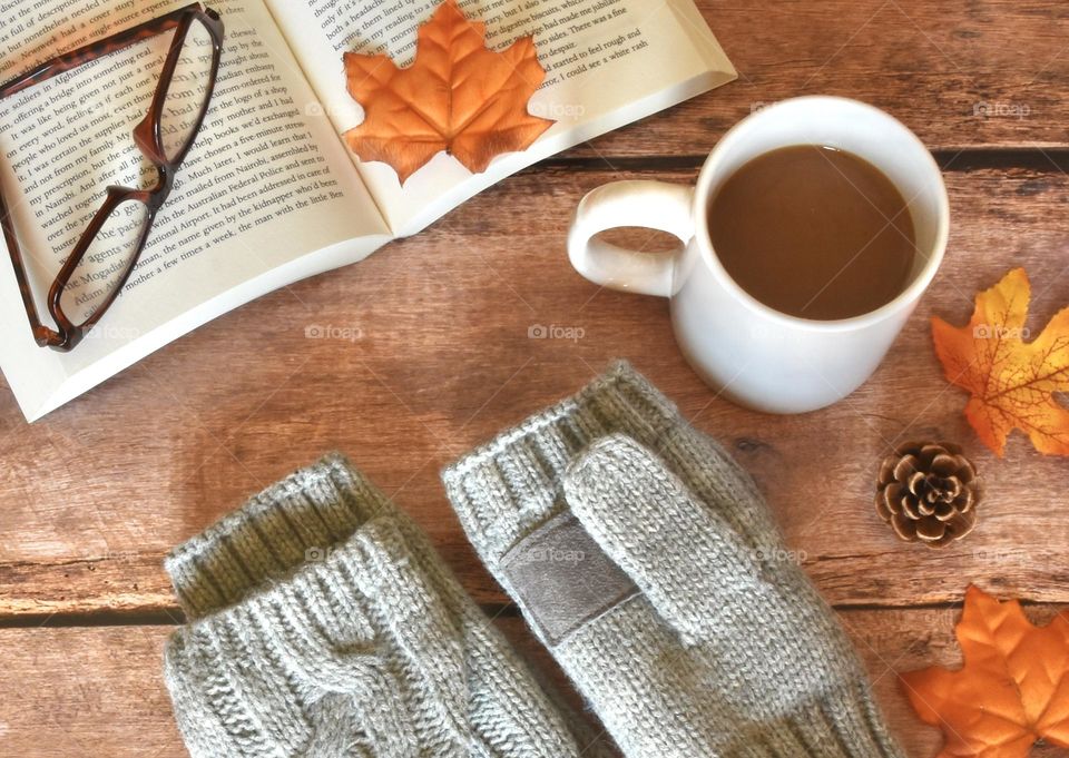 Hot tea, gloves, book, glasses, leaf, still life