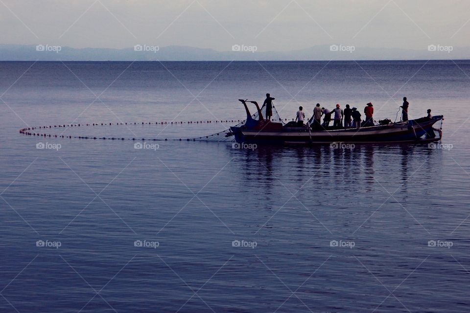 catching. senggigi beach, west lombok