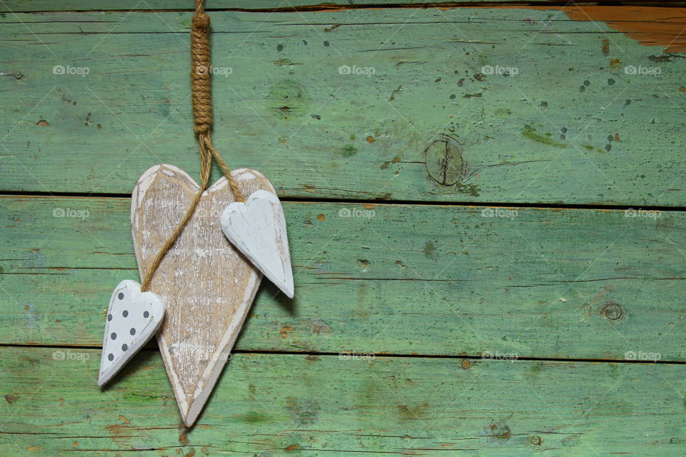 close-up of a wooden heart decorations on a wooden table