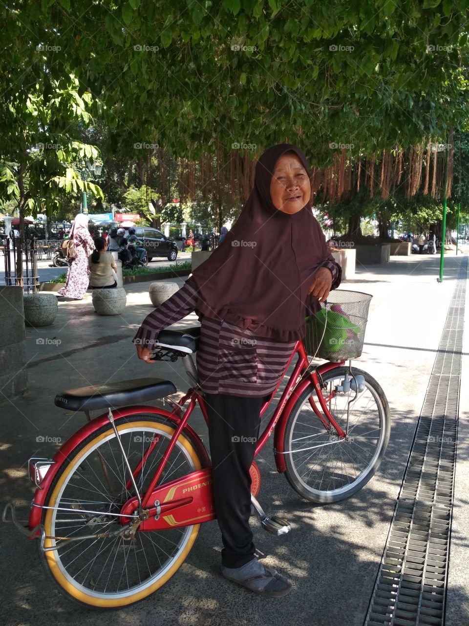 old woman with Red Bycycle