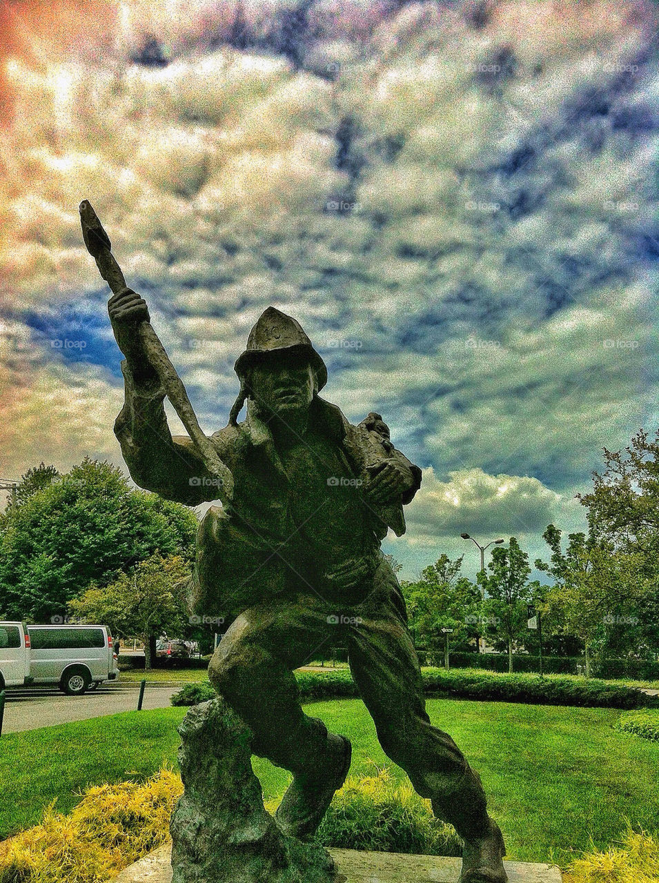 sky clouds statue firefighter by lguarini