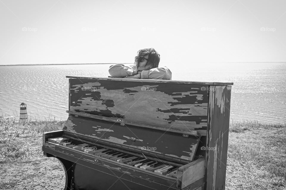 Girl next to piano