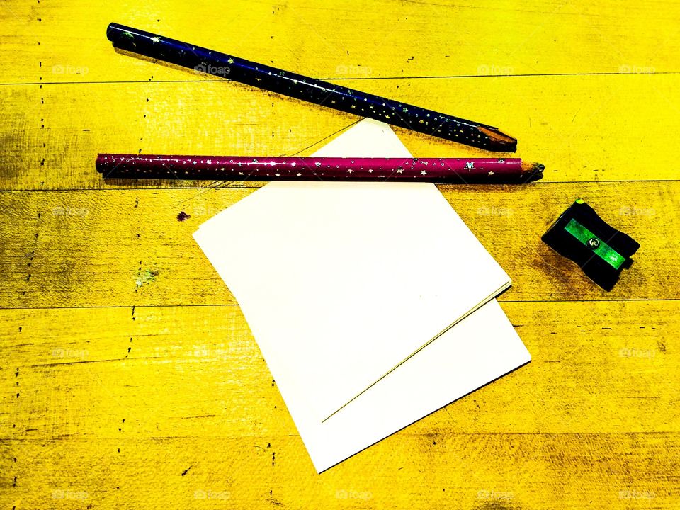 Pencils and notepad on counter 