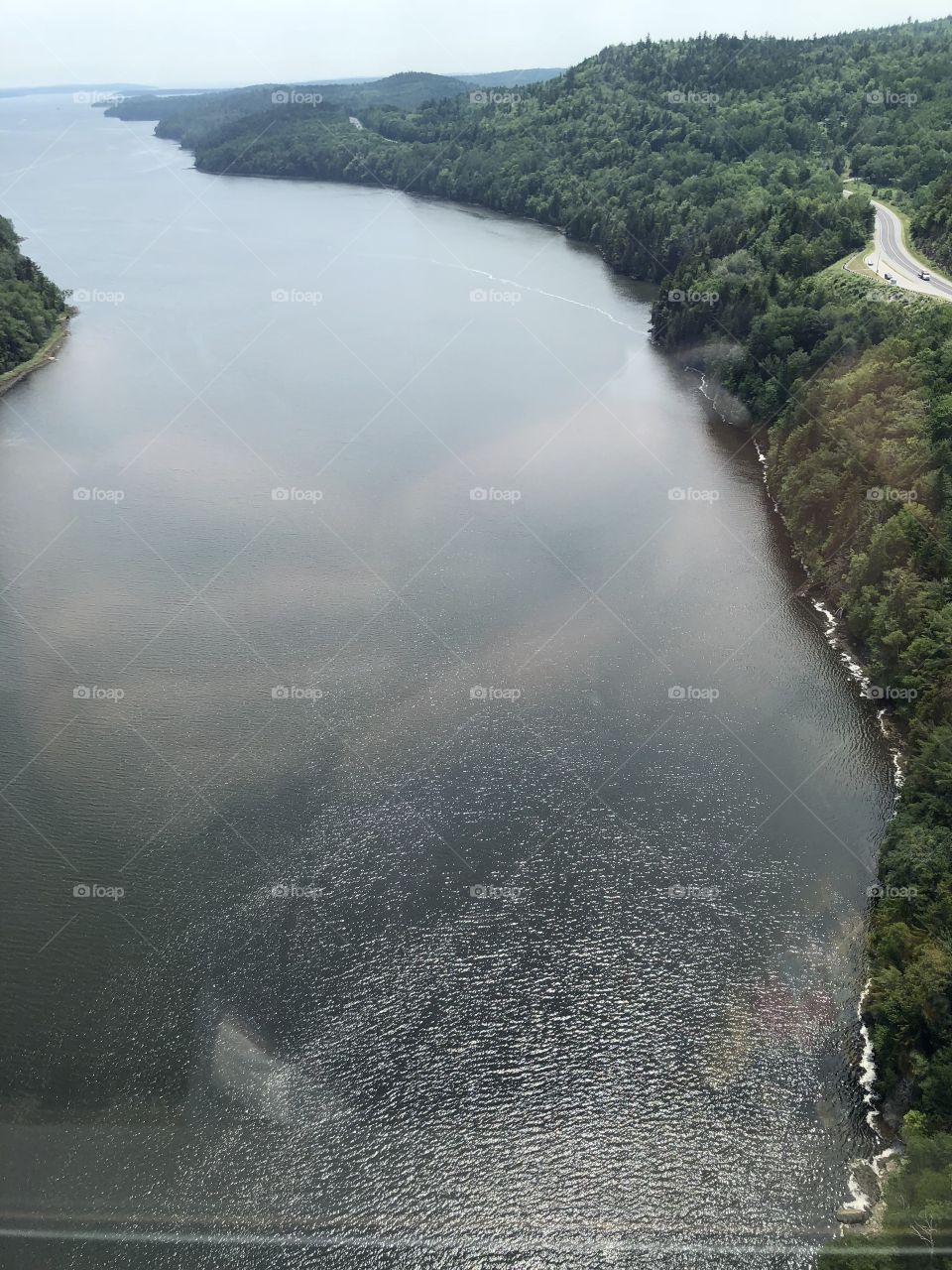 Aerial view of Penobscot Bay and surrounding forested coastlne from top of Penobscot Narrows Bridge Observatory Tower, the largest bridge tower observatory in the world.
