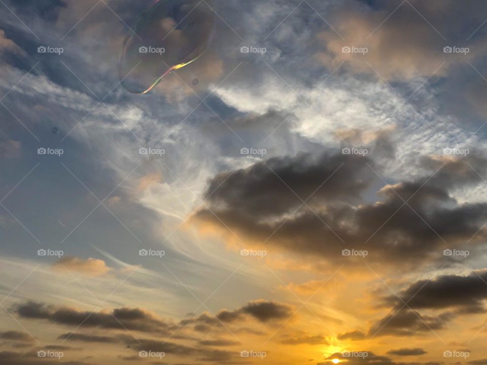blowing bubbles at sunset in Encinitas, California