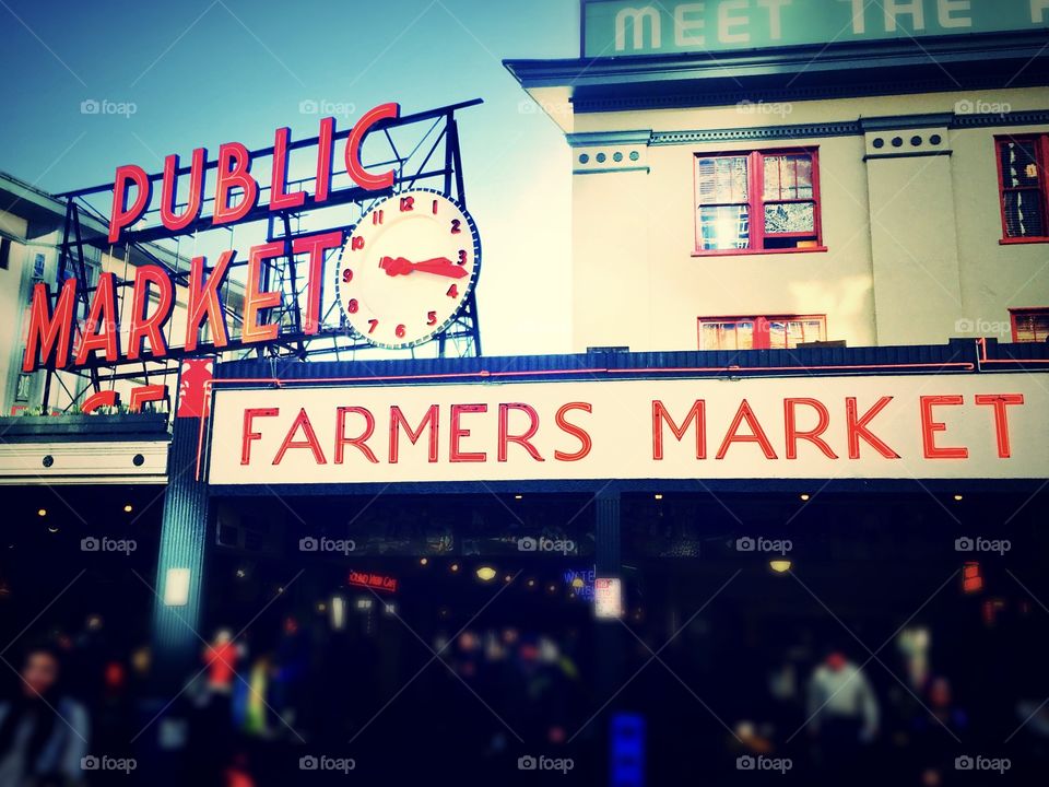 Pike Place Market in Seattle, Washington bustles with locals and tourists alike on a busy weekend 