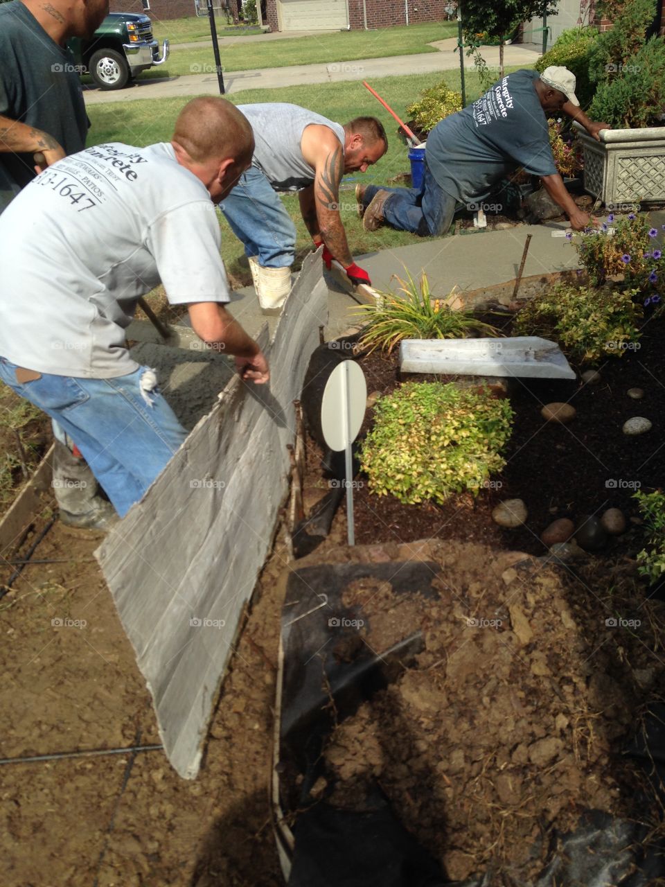 Form, cement pour and workmen