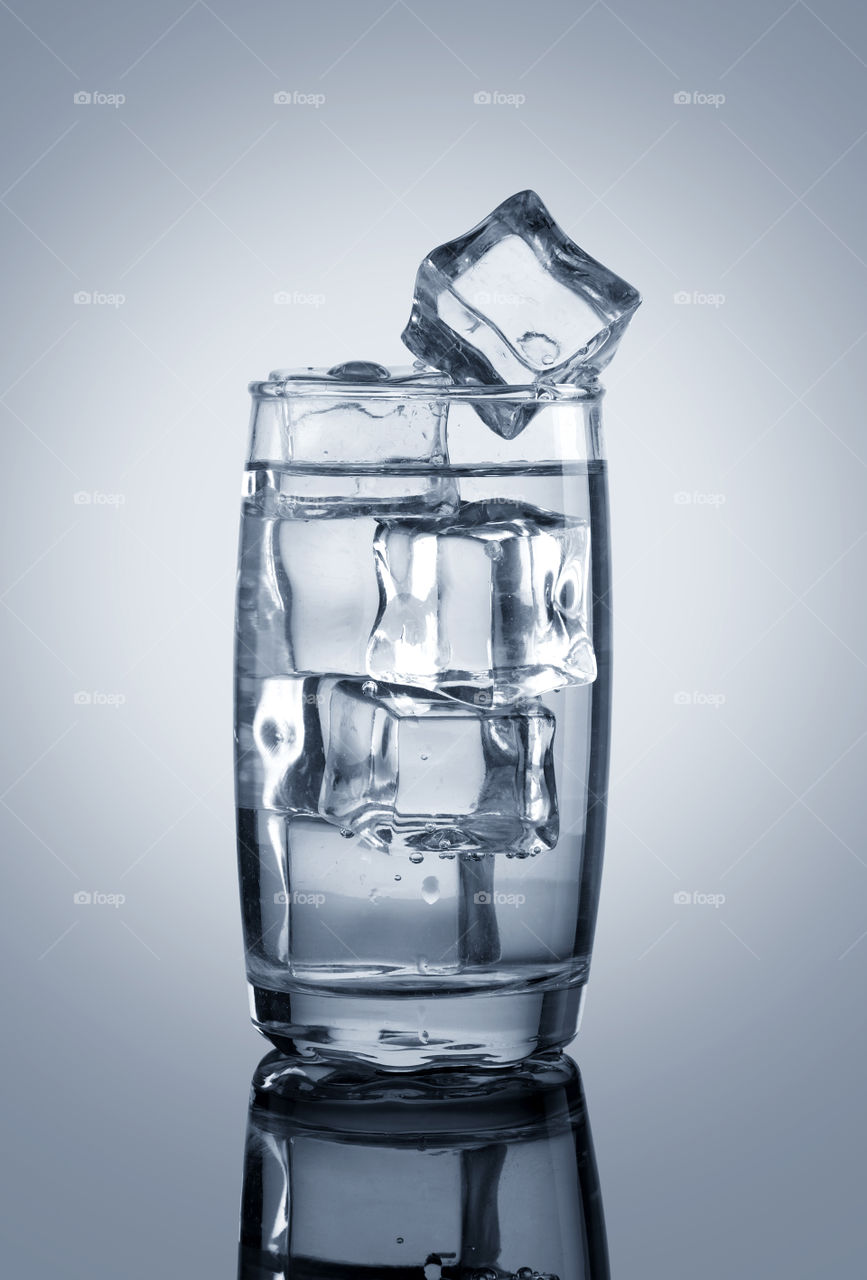 Glass of chilled water with ice cubes