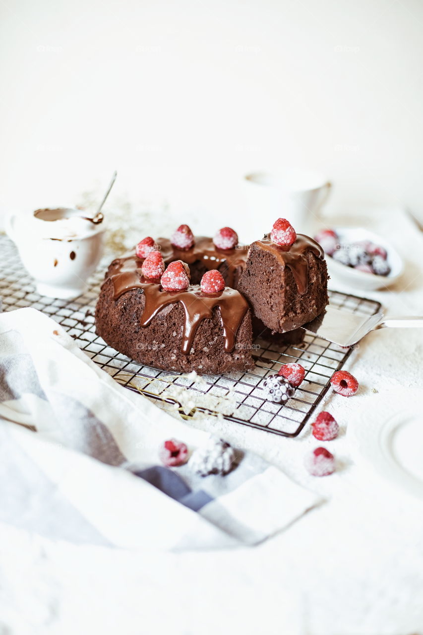 chocolate cake/brownie with chocolate mousse and raspberry on the top food photography