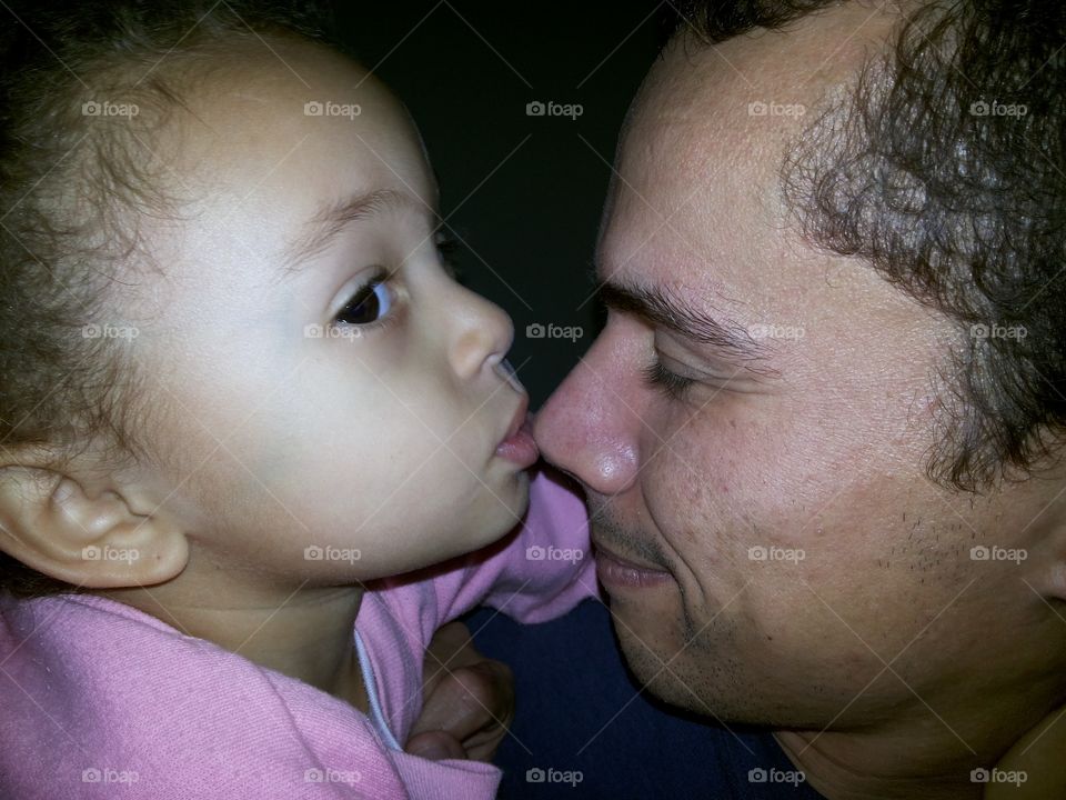 Side view of father and daughter at home