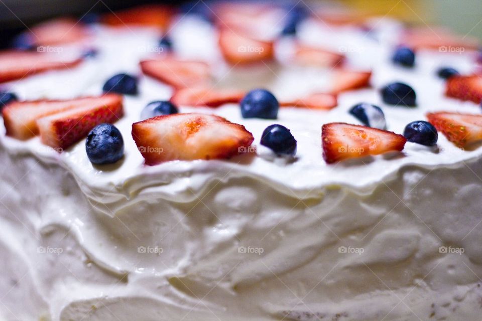 Close-up of cake with strawberries and blueberries