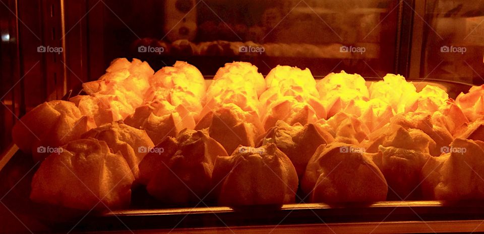 Yellow. Durian filled purée inside these golden yellow puffs.