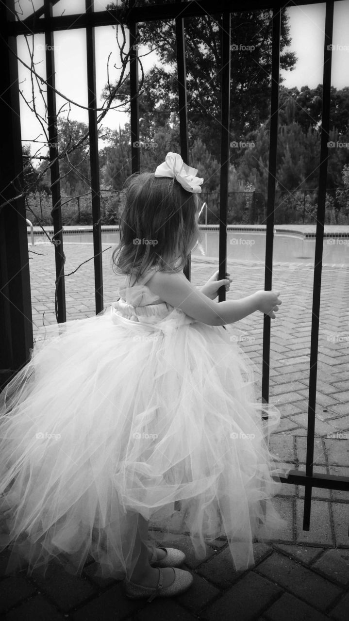 Flower girl. Wishing she could trade the dress for a swimsuit...