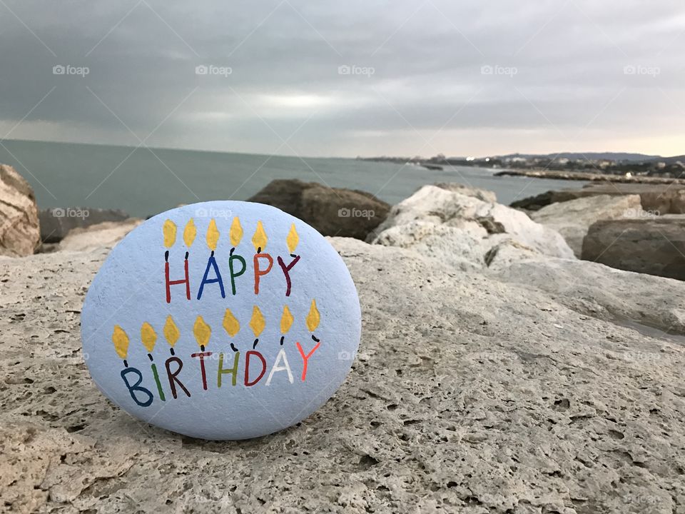 Happy birthday message on a stone