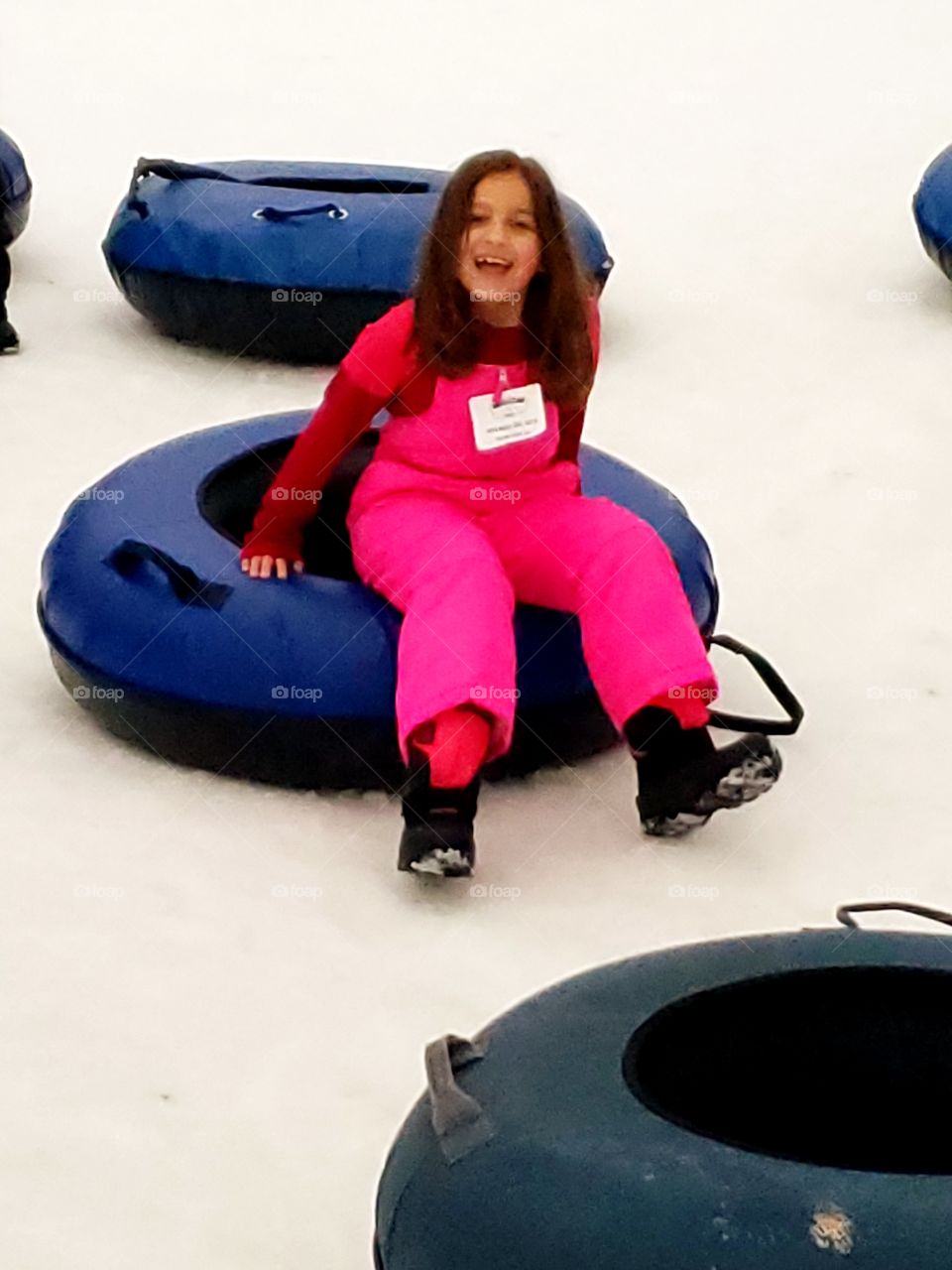girl having fun laughing in snow