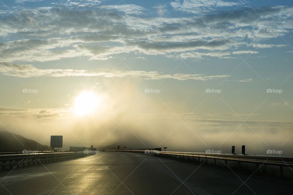 Misty morning sunrise on the road. Slovakia