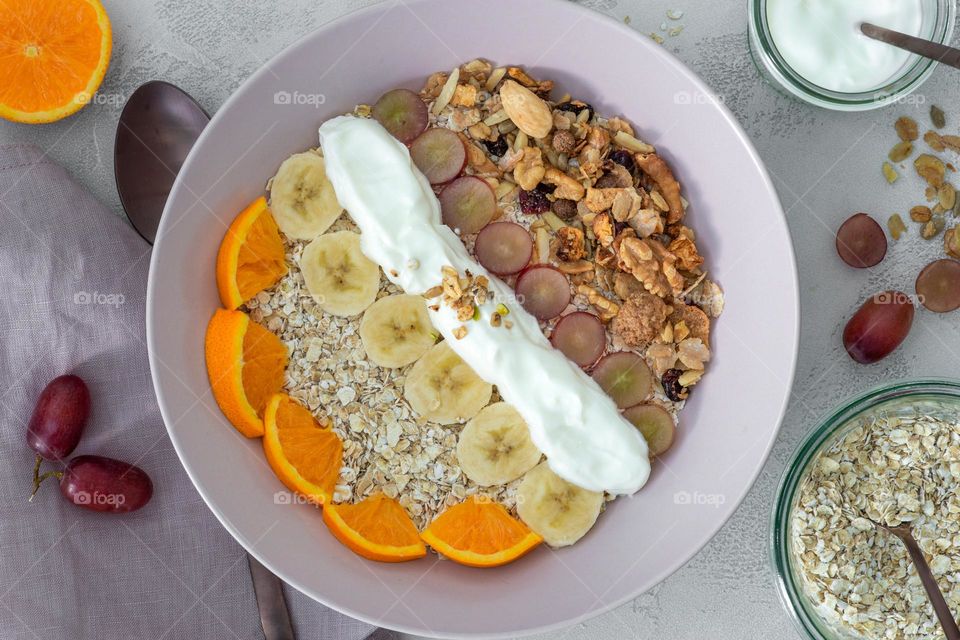 healthy muesli with fruits and yogurt