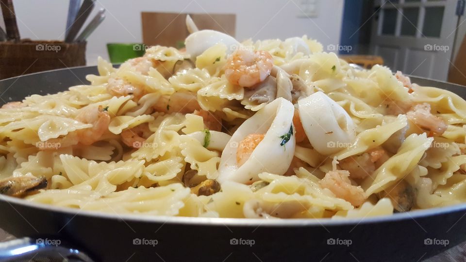 Close-up of bow tie pasta with prawn