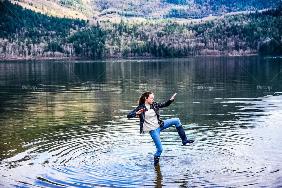 High stepping in the lake with rubber boots in BC, Canada 