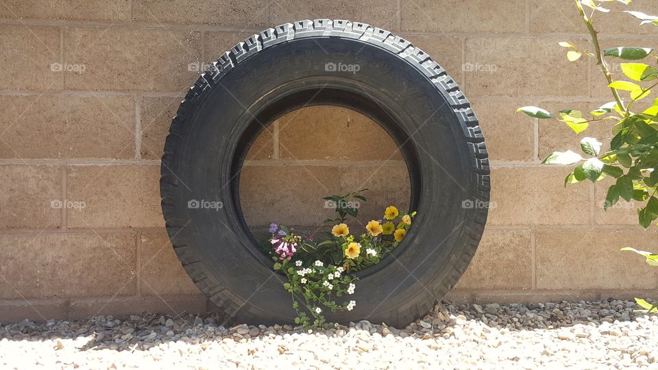 Tire planter with flowers