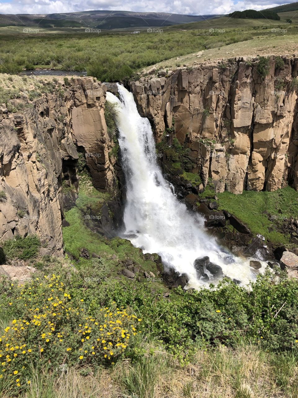 Beautiful waterfall view and mountain cliffs 