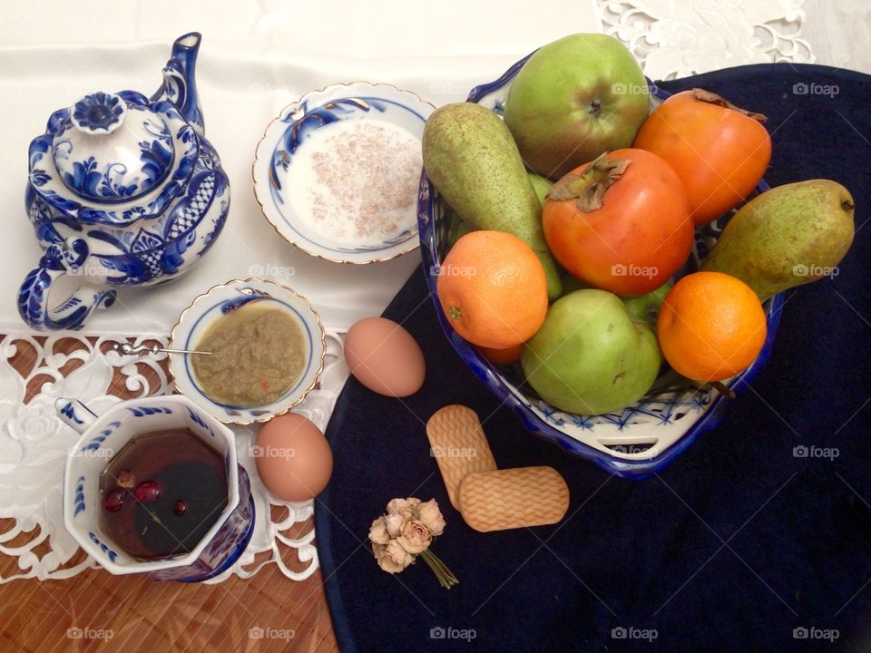 Healthy breakfast with fruits cookies tea and cereals 