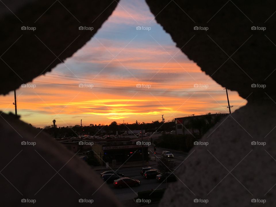 Sunset through a brick lattice