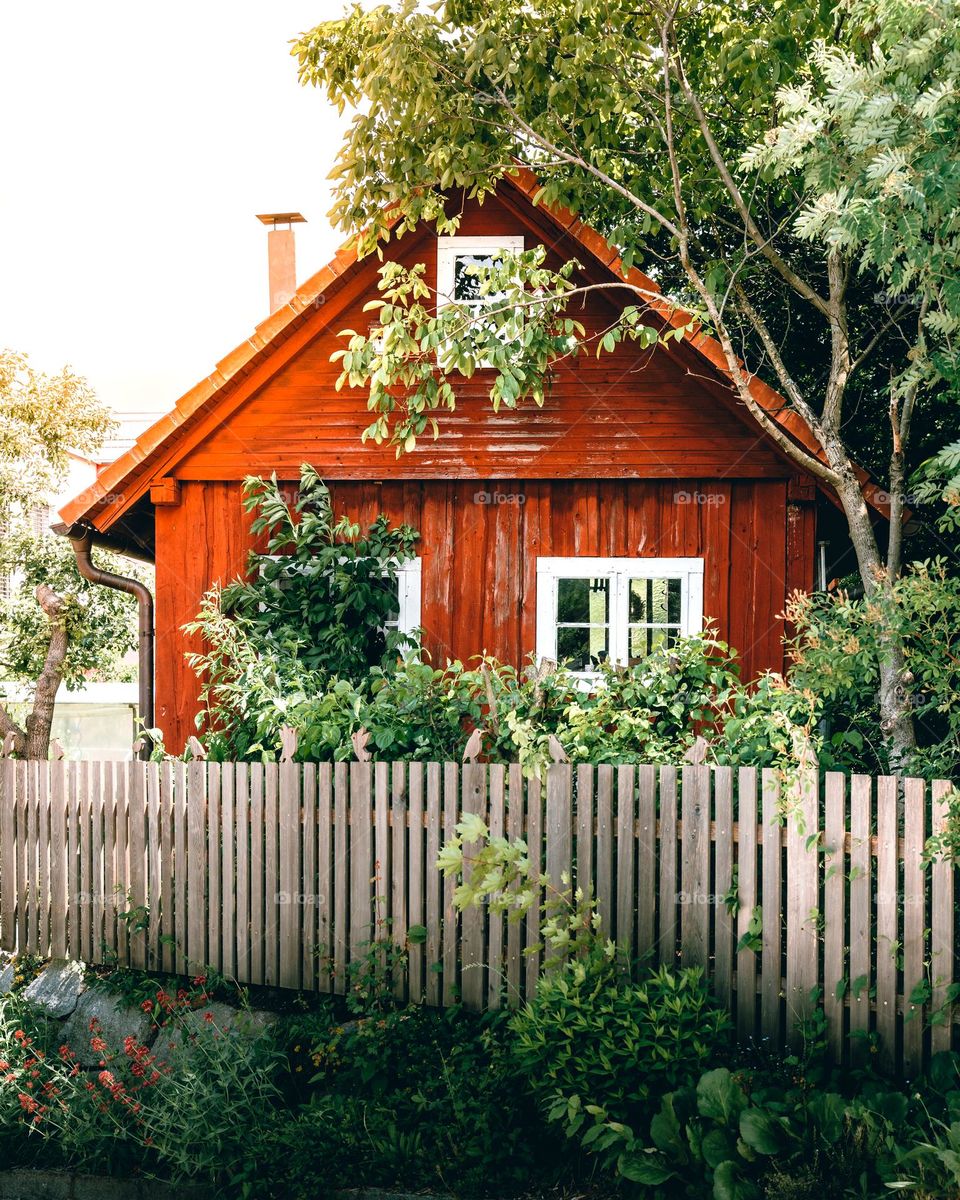 A red wooden hut