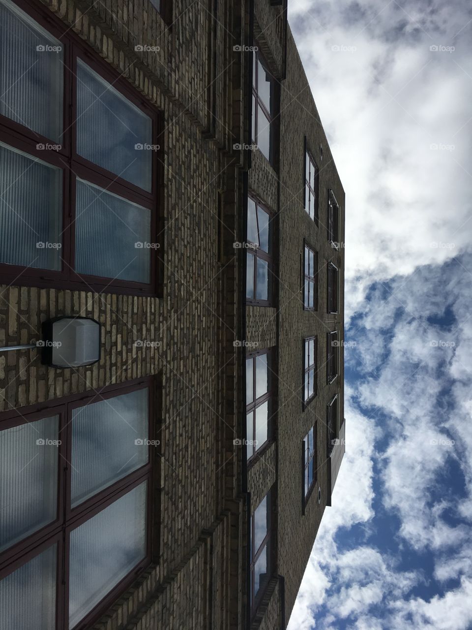 Old building from below with clouds