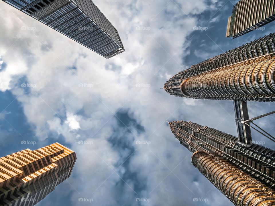 Skyscrappers piercing the clouds in Kuala Lumpur, Malaysia