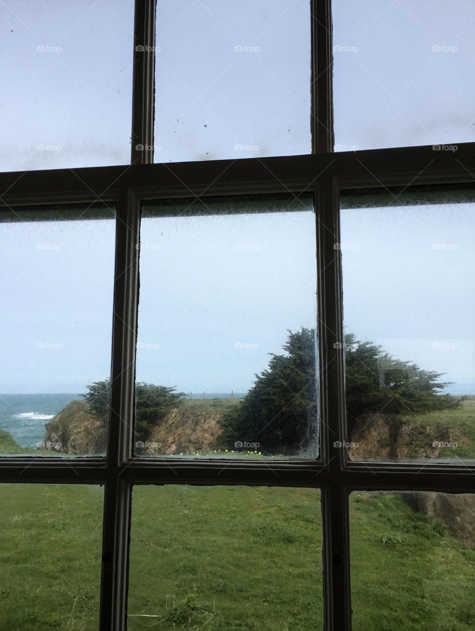 Outside the window, landscape of a coastal view.