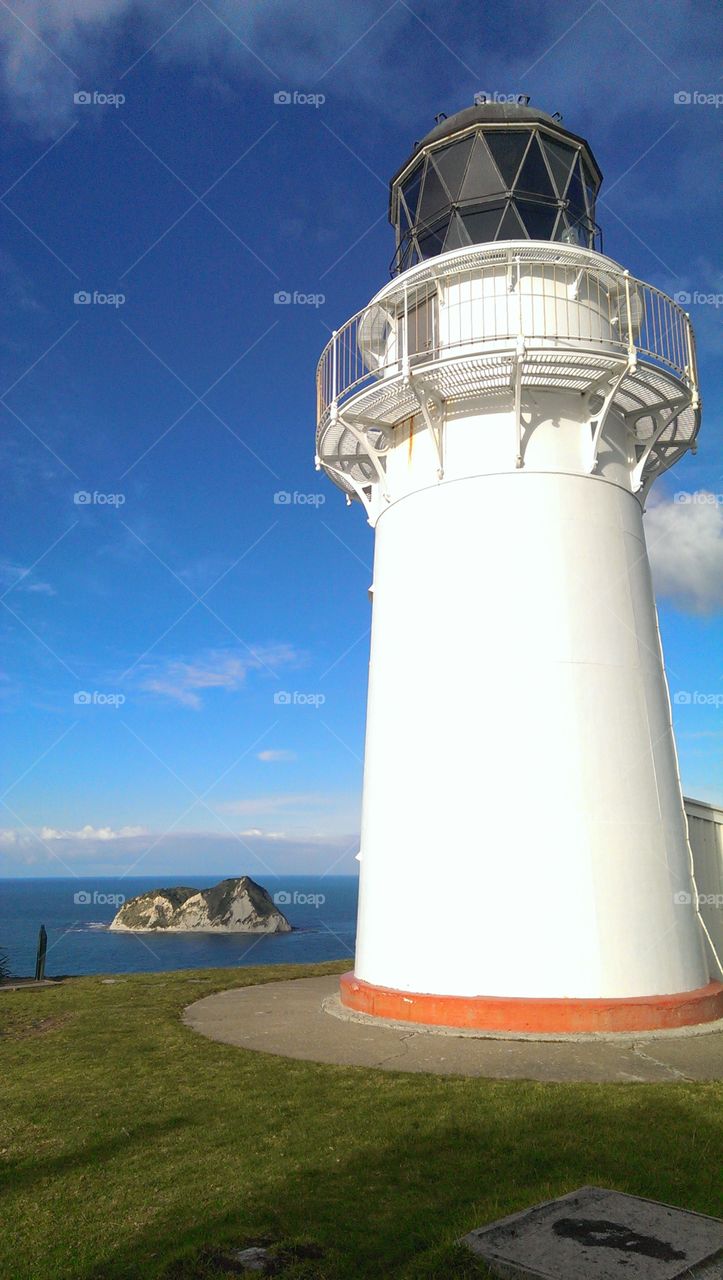 Low angle view of lighthouse on seashore