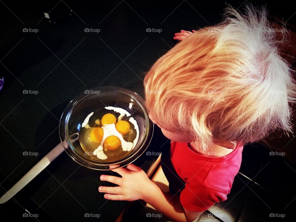 Helping dad cook breakfast