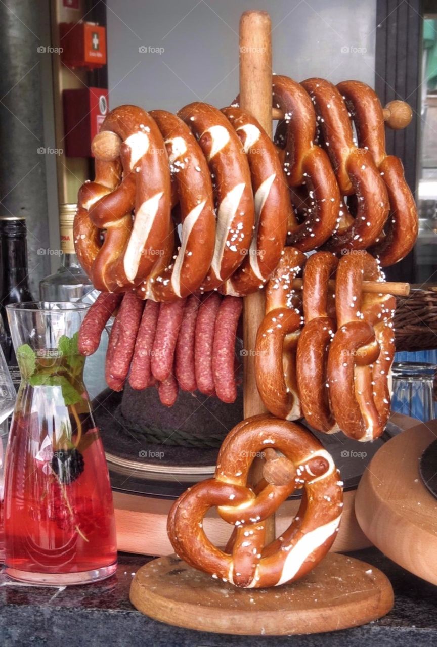 Pretzels and sausages on the bar rack