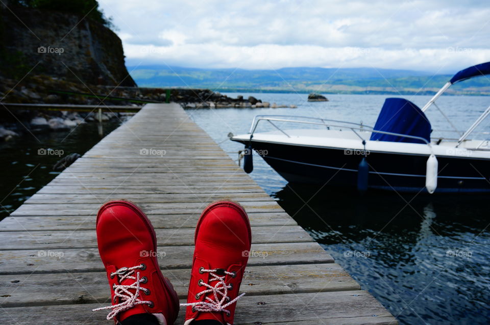 Taking a rest after hiking through a small French town, Yvoire. These Timberland boots were captured against the backdrop of sea and sky