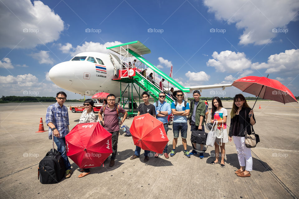 Group tour in front of the plane