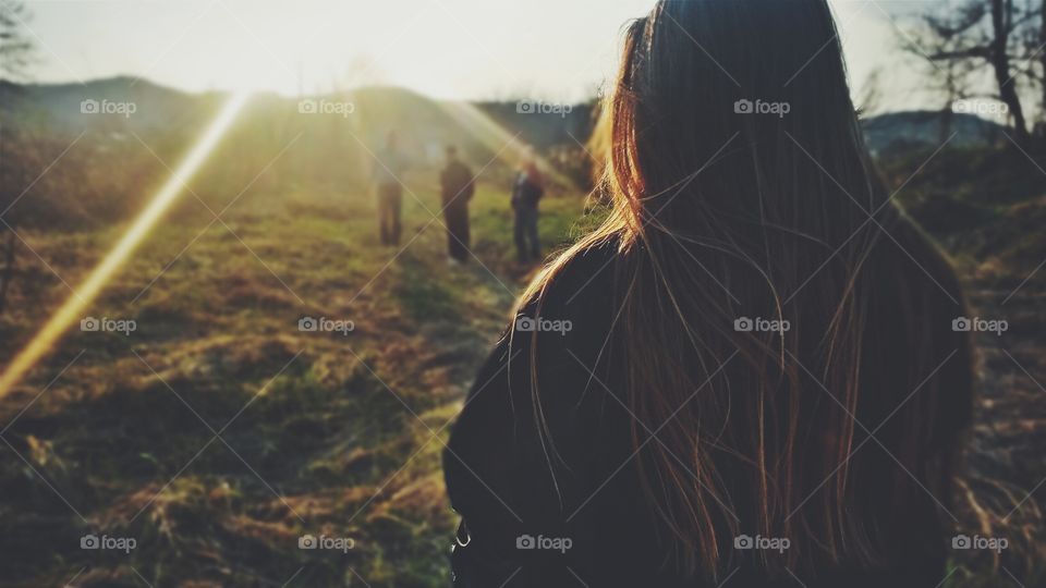 spring break. walking on the green land while the sun is still up
