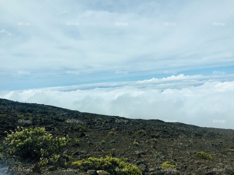 Above the clouds top of the volcano 