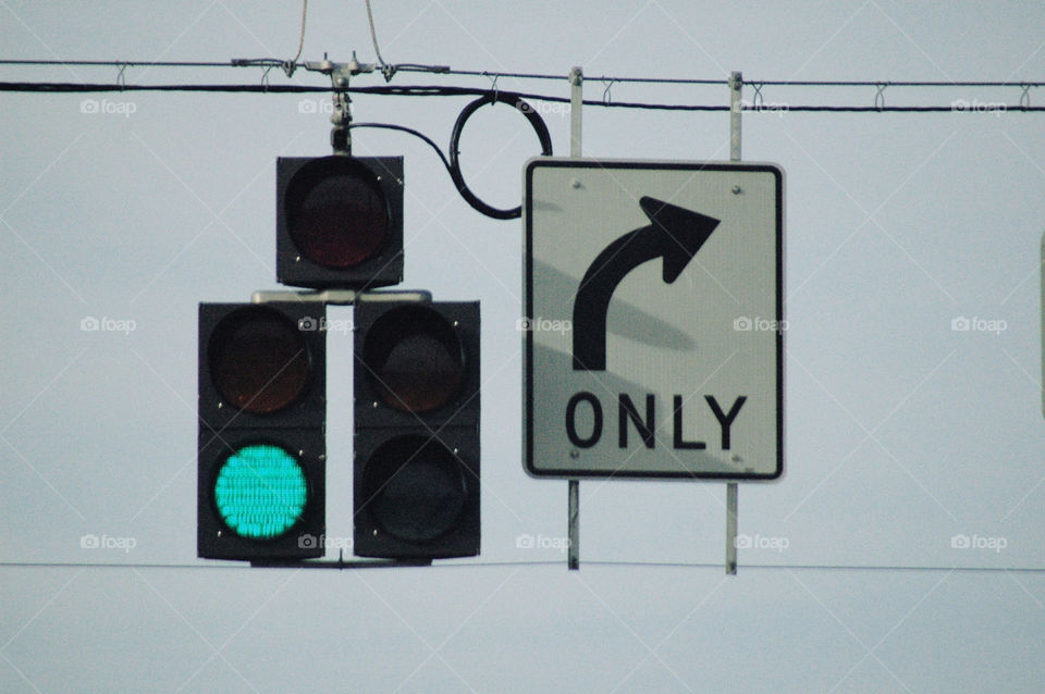 Green light with right turn only sign. 