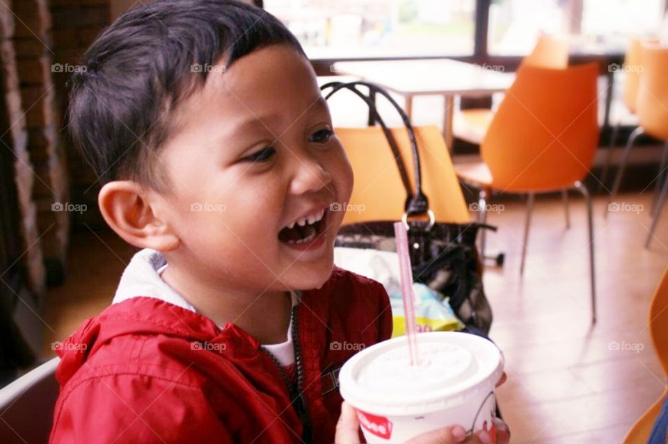 Close-up of a boy laughing
