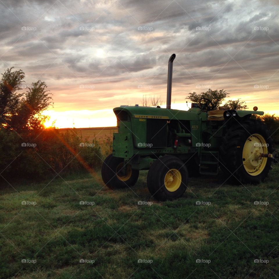 Antique John Deere 4520 at sunset in Southwest Kansas 