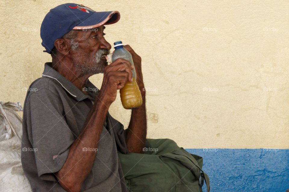Cuban People.Senior man having a snack.