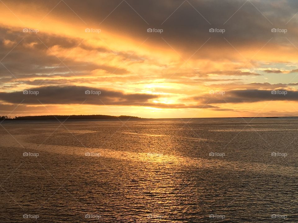 Yellow sky reflecting in the ocean