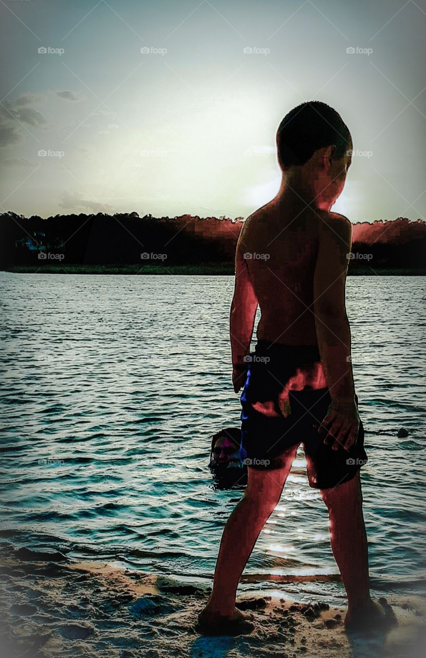 foap mission the golden hour boy on beach in the glow of the sunset
