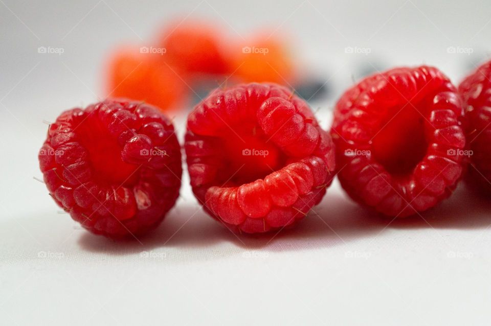 Three raspberries on a row