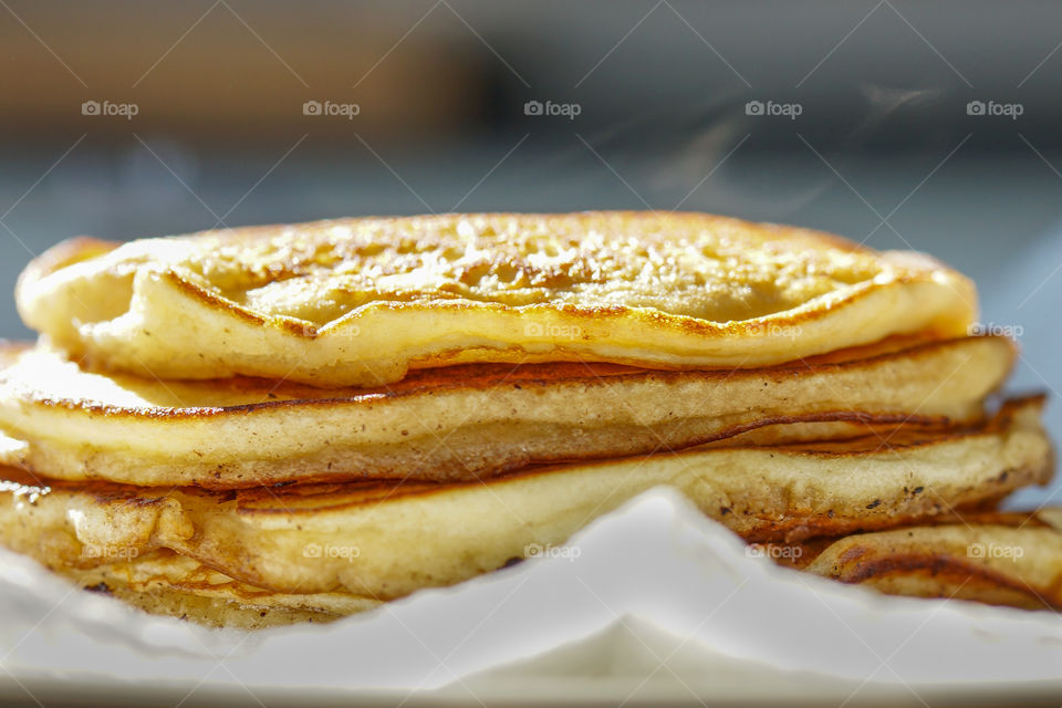 stack of hot pancakes, steam