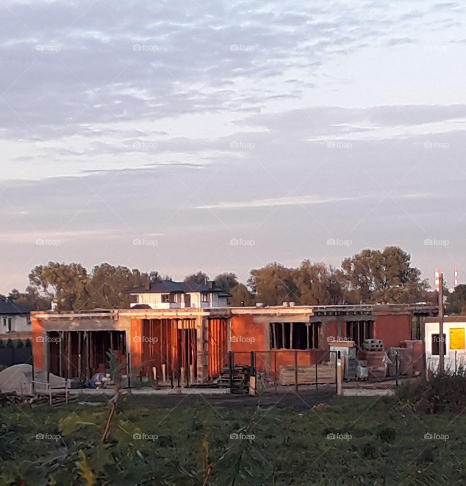 construction of a new house as seen at sunset